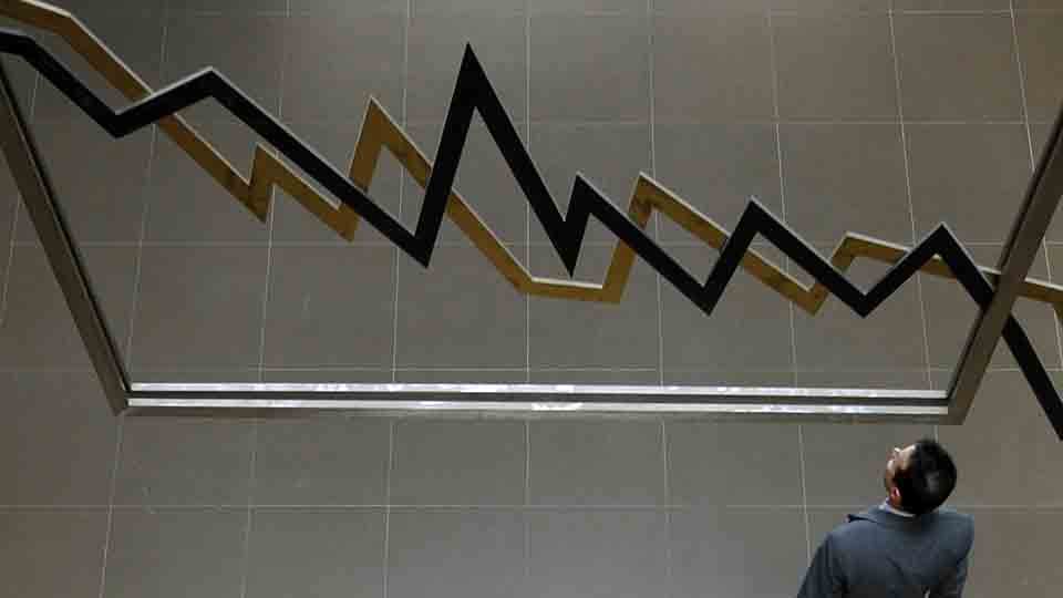 A man walks inside the Athens' stock exchange in Athens April 28, 2010.