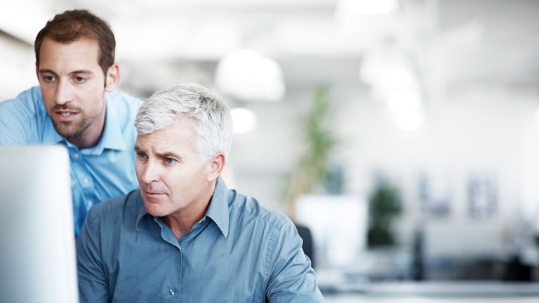 Two men discussing a project