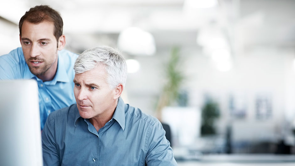 Two men discussing a project