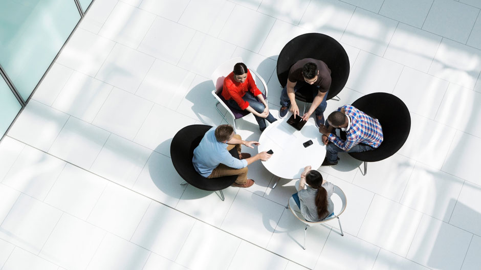 Overhead view of colleagues in meeting